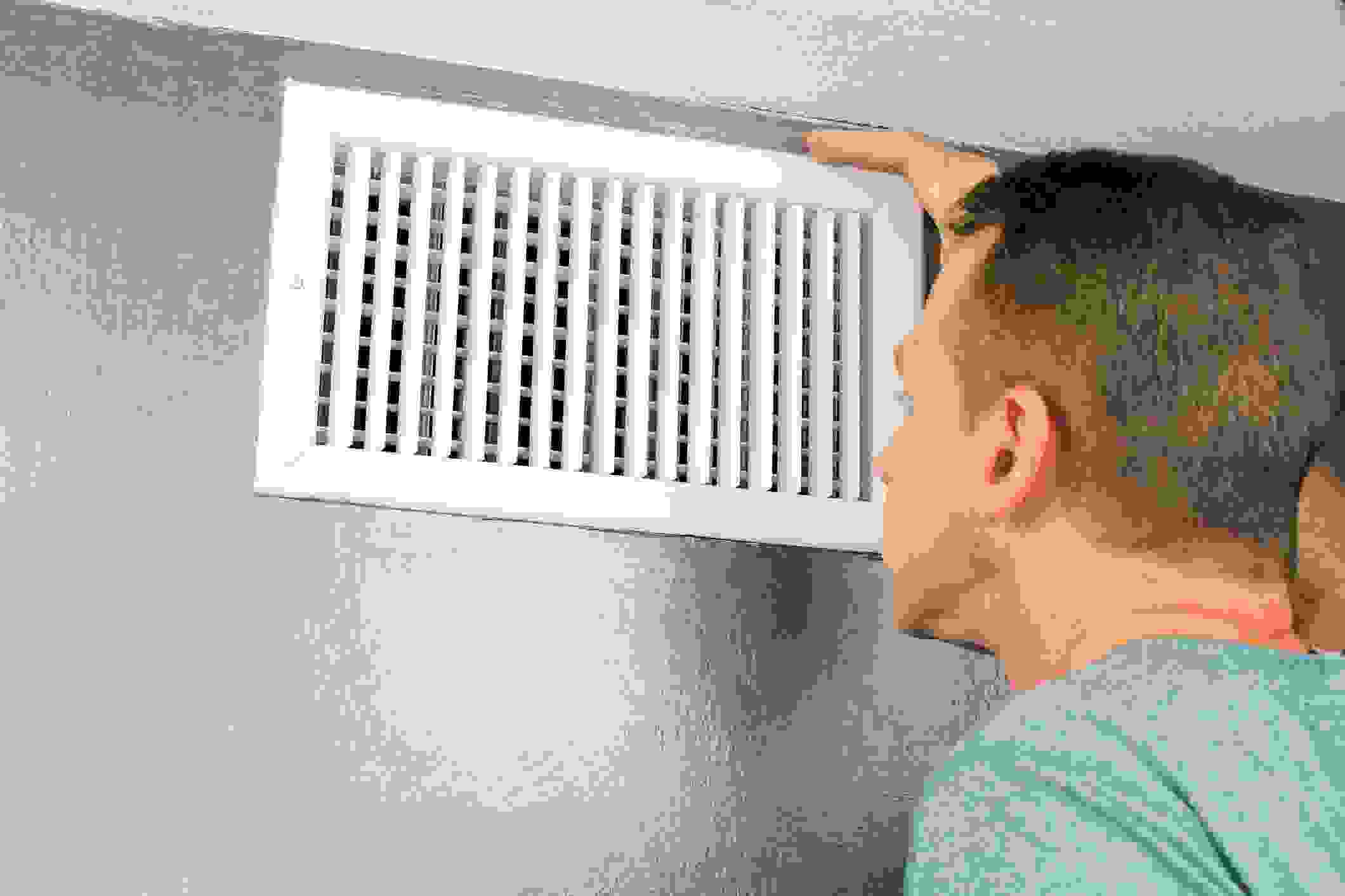 Why Do My Air Ducts Smell Bad Pro Energy Solution   Man Looking In Air Vent 